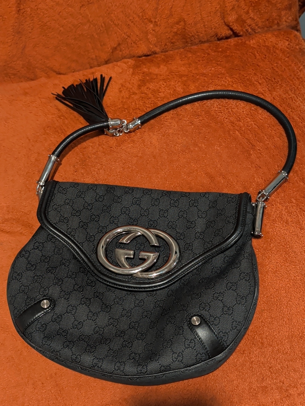 Gucci Black GG Canvas Saddle Shoulder Bag with Silver Hardware and Tassel